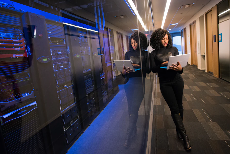 Engineer reviewing systems inside a data center
